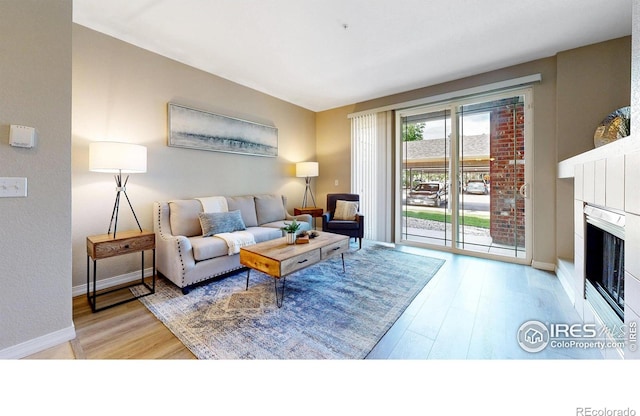 2133 Krisron Rd Unit D103, Fort Collins, CO 80525 - living area with wood finished floors and a fireplace
