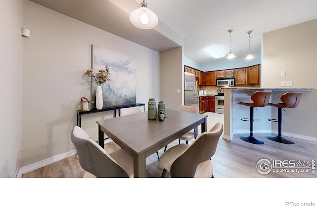 2133 Krisron Rd Unit D103, Fort Collins, CO 80525 - dining area with light wood finished floors and baseboards