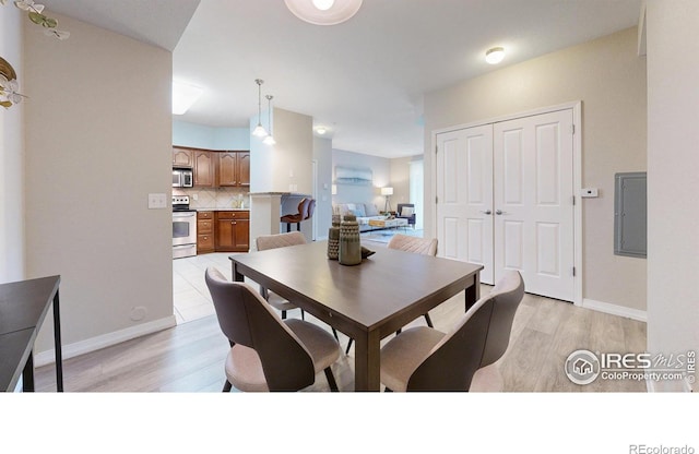 2133 Krisron Rd Unit D103, Fort Collins, CO 80525 - dining area featuring light wood finished floors and electric panel