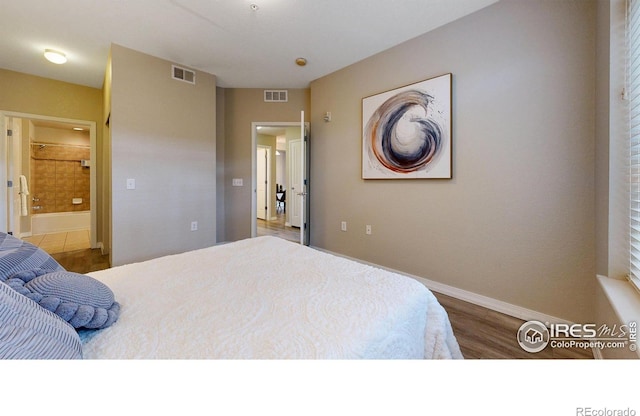 2133 Krisron Rd Unit D103, Fort Collins, CO 80525 - bedroom with wood finished floors and ensuite bathroom