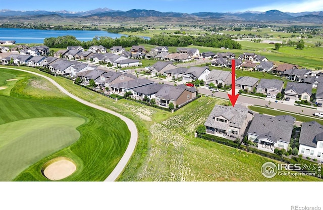 3304 Heron Lakes Pkwy, Berthoud, CO 80513 - aerial perspective of suburban area with a water and mountain view and a golf course