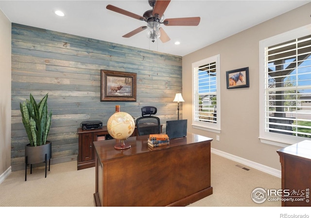 3304 Heron Lakes Pkwy, Berthoud, CO 80513 - home office featuring light carpet, wooden walls, a ceiling fan, plenty of natural light, and recessed lighting