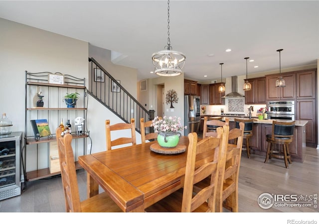 3304 Heron Lakes Pkwy, Berthoud, CO 80513 - dining room featuring a chandelier, light wood-type flooring, and recessed lighting