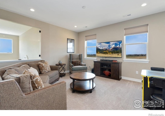 3304 Heron Lakes Pkwy, Berthoud, CO 80513 - carpeted living room with baseboards and recessed lighting