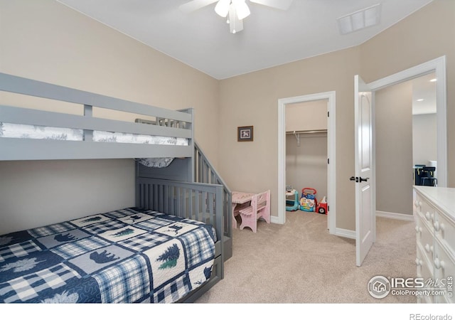 3304 Heron Lakes Pkwy, Berthoud, CO 80513 - bedroom featuring light colored carpet, a closet, ceiling fan, and a spacious closet