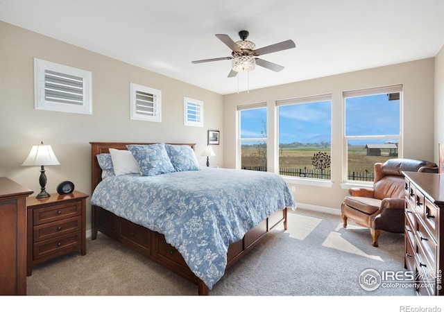 3304 Heron Lakes Pkwy, Berthoud, CO 80513 - bedroom featuring light colored carpet and a ceiling fan