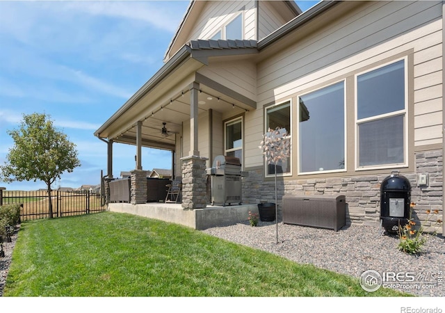 3304 Heron Lakes Pkwy, Berthoud, CO 80513 - view of patio with a ceiling fan and exterior kitchen