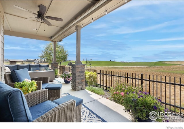 3304 Heron Lakes Pkwy, Berthoud, CO 80513 - fenced backyard featuring ceiling fan, a patio, and an outdoor hangout area