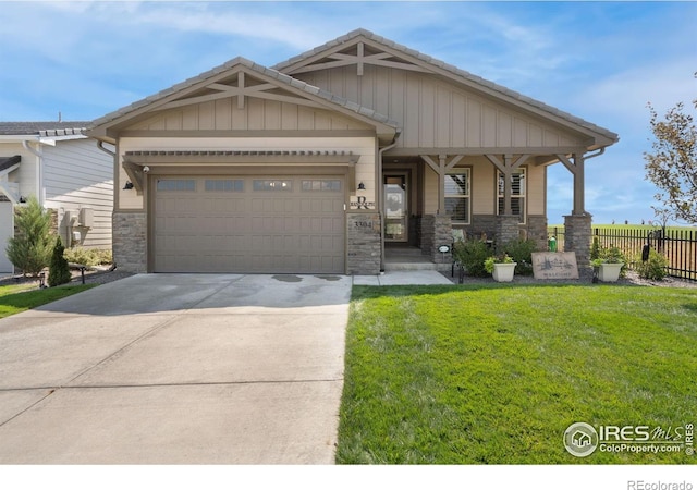 3304 Heron Lakes Pkwy, Berthoud, CO 80513 - craftsman-style house with stone siding, a garage, and concrete driveway