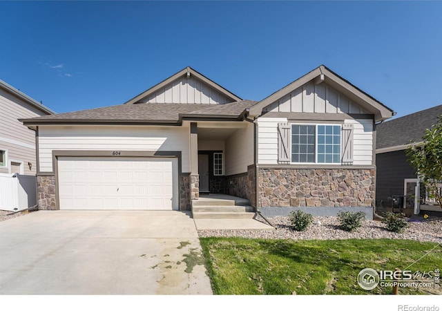 604 Rosedale St, Severance, CO 80550 - view of front of house with stone siding, an attached garage, board and batten siding, driveway, and a shingled roof
