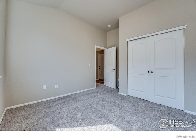 604 Rosedale St, Severance, CO 80550 - unfurnished bedroom with carpet flooring, a closet, and vaulted ceiling