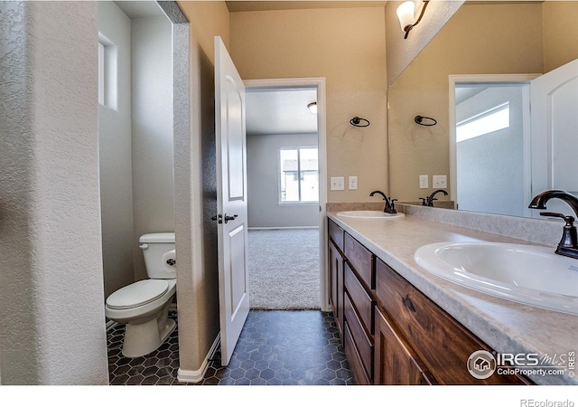 604 Rosedale St, Severance, CO 80550 - bathroom with double vanity and a textured wall