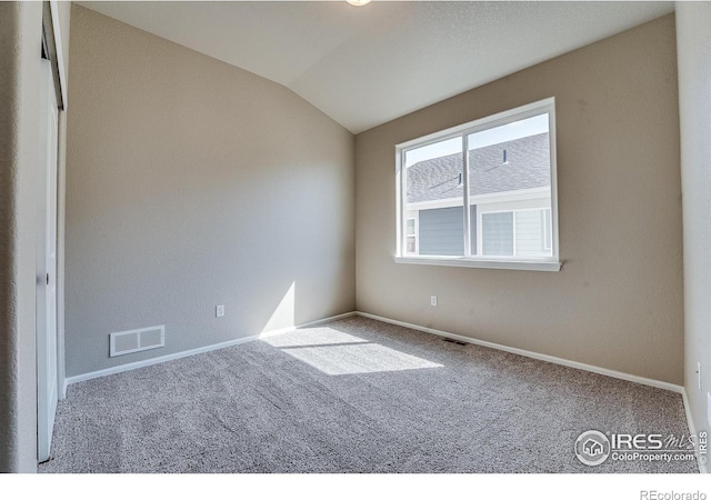 604 Rosedale St, Severance, CO 80550 - unfurnished room featuring carpet and lofted ceiling