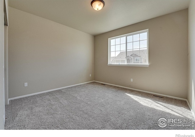 604 Rosedale St, Severance, CO 80550 - carpeted empty room featuring baseboards