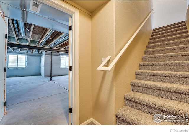 604 Rosedale St, Severance, CO 80550 - stairway with concrete floors and a textured wall