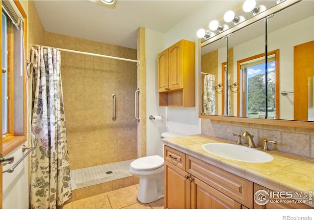 2160 Devils Gulch Rd, Estes Park, CO 80517 - full bath featuring a shower stall, vanity, tile patterned floors, and decorative backsplash