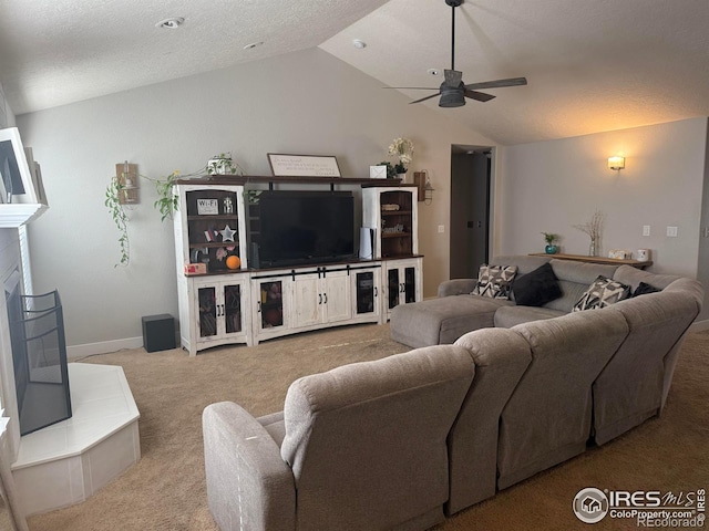 1460 Hawkridge Rd, Eaton, CO 80615 - living room featuring carpet, lofted ceiling, ceiling fan, and a fireplace with raised hearth