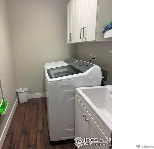1460 Hawkridge Rd, Eaton, CO 80615 - laundry area featuring cabinet space, washing machine and clothes dryer, and dark wood-style floors