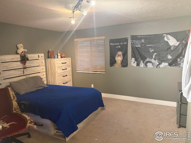 1460 Hawkridge Rd, Eaton, CO 80615 - carpeted bedroom featuring a textured ceiling and a ceiling fan