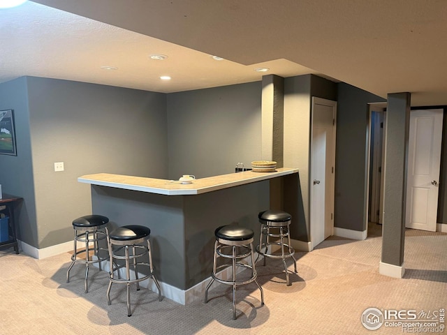 1460 Hawkridge Rd, Eaton, CO 80615 - indoor dry bar featuring light colored carpet and recessed lighting