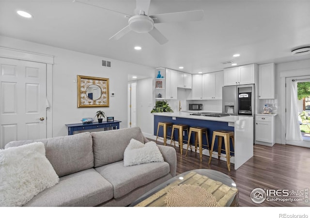 7131 Pontiac St, Commerce City, CO 80022 - living room with a ceiling fan, dark wood-style floors, and recessed lighting