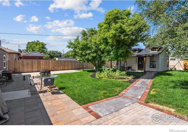 7131 Pontiac St, Commerce City, CO 80022 - fenced backyard with a patio