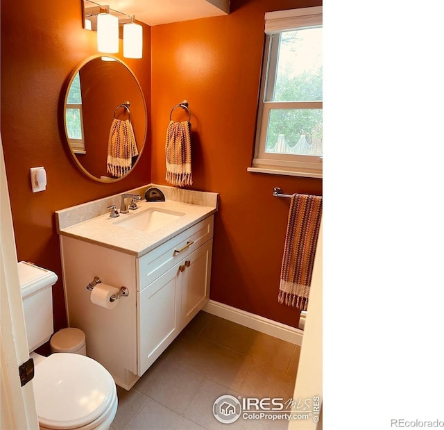 4303 30th St, Boulder, CO 80301 - half bath with vanity and tile patterned flooring