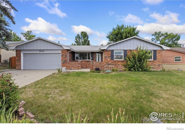 2516 Mountain View Ave, Longmont, CO 80503 - ranch-style home featuring an attached garage, brick siding, driveway, and a front yard