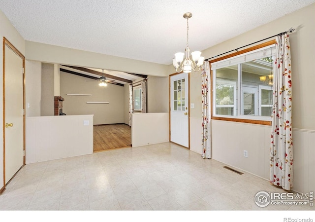 2516 Mountain View Ave, Longmont, CO 80503 - empty room with a chandelier, ceiling fan, and a textured ceiling