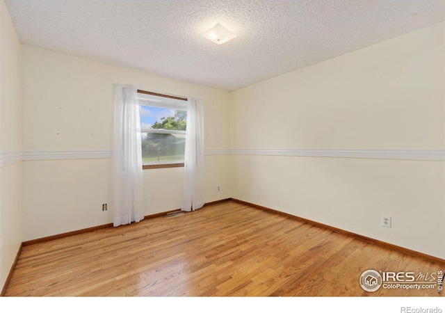 2516 Mountain View Ave, Longmont, CO 80503 - unfurnished room featuring light wood-type flooring and a textured ceiling