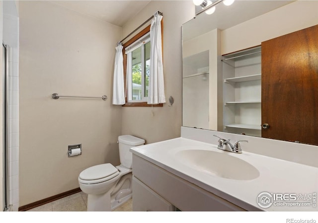 2516 Mountain View Ave, Longmont, CO 80503 - bathroom featuring vanity, a shower, and tile patterned flooring