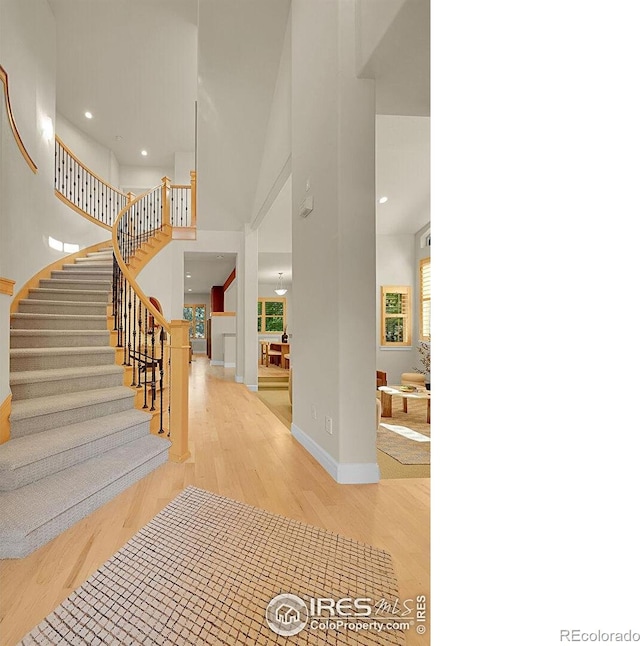 2861 Shoshone Trl, Lafayette, CO 80026 - foyer featuring wood finished floors, stairway, and recessed lighting