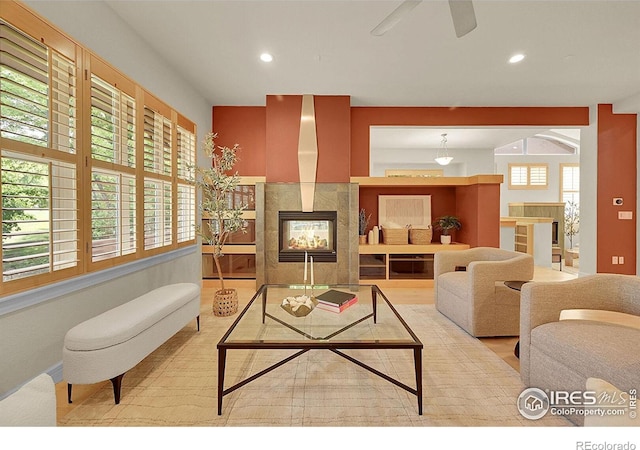 2861 Shoshone Trl, Lafayette, CO 80026 - living area featuring a tile fireplace, recessed lighting, and ceiling fan