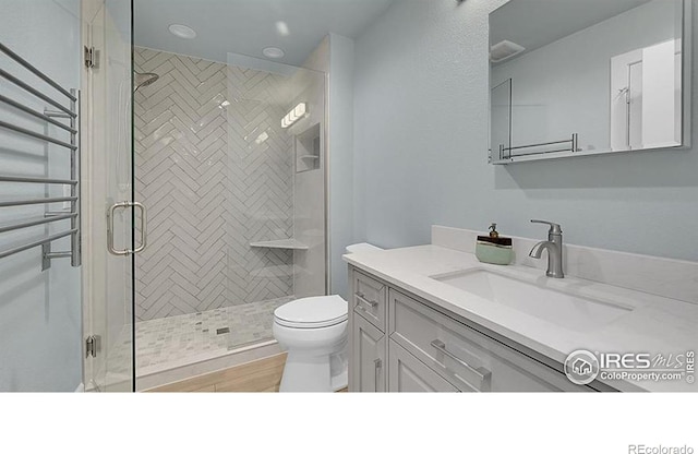 2861 Shoshone Trl, Lafayette, CO 80026 - full bath with vanity, a shower stall, and recessed lighting
