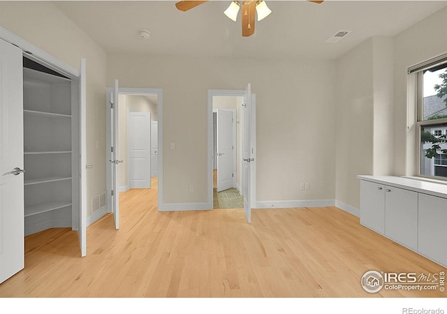 2861 Shoshone Trl, Lafayette, CO 80026 - unfurnished bedroom featuring light wood-style floors and a ceiling fan