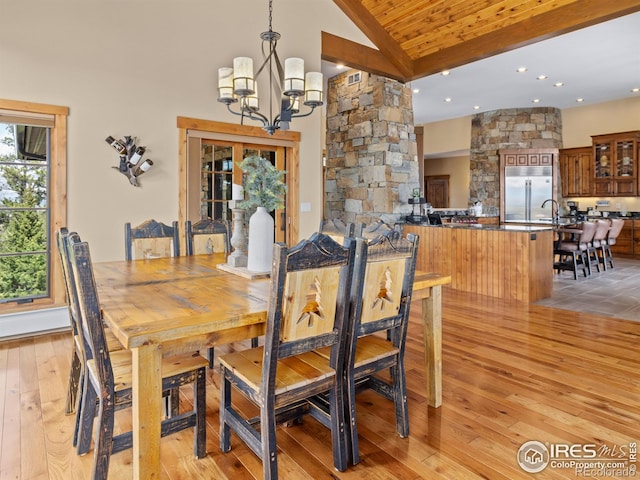 3411 Hillcrest Ln, Estes Park, CO 80517 - dining room featuring light wood-style flooring, a chandelier, recessed lighting, and high vaulted ceiling