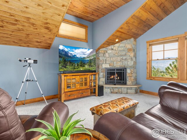 3411 Hillcrest Ln, Estes Park, CO 80517 - carpeted living room featuring wood ceiling and a stone fireplace