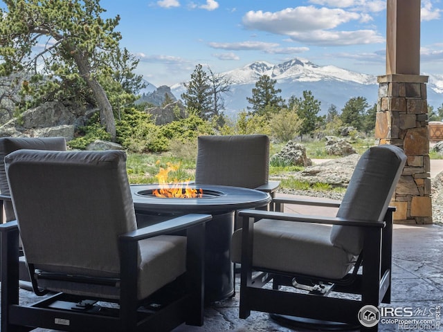 3411 Hillcrest Ln, Estes Park, CO 80517 - view of patio / terrace with a mountain view and an outdoor fire pit