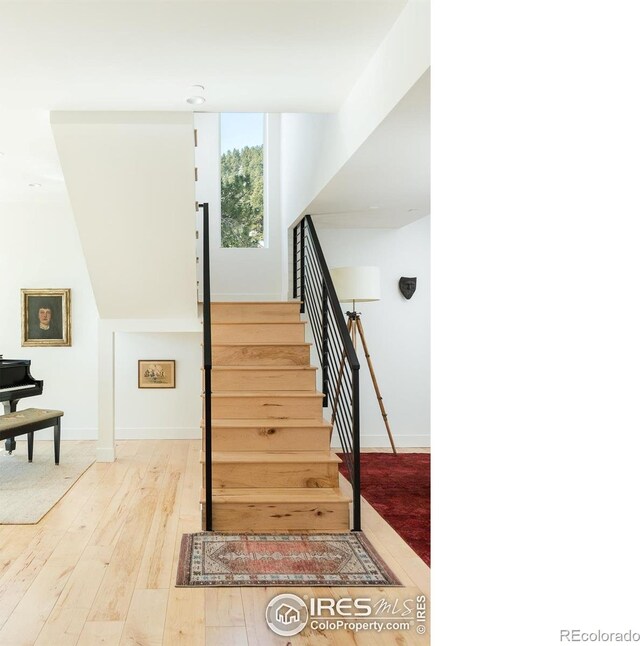 514 Granite Dr, Boulder, CO 80302 - staircase featuring wood-type flooring and baseboards