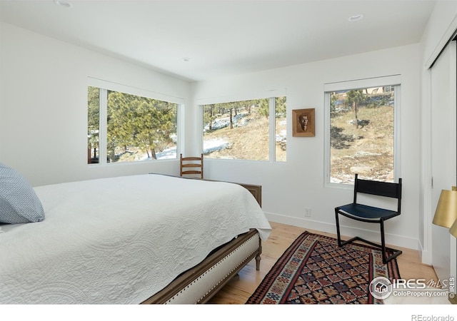 514 Granite Dr, Boulder, CO 80302 - bedroom featuring multiple windows, light wood-style flooring, and recessed lighting