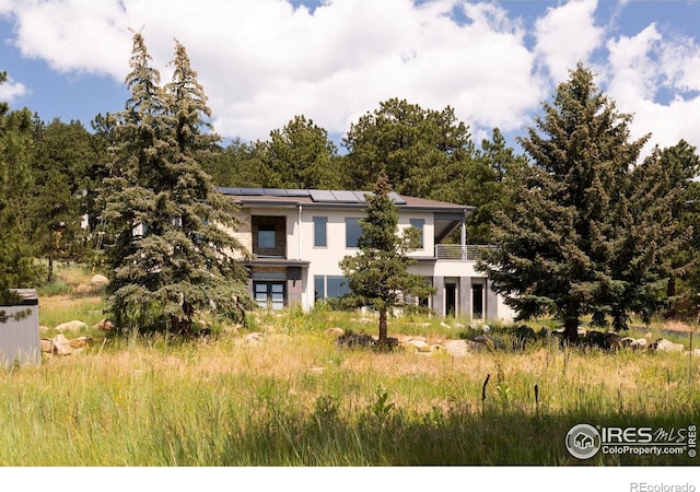 514 Granite Dr, Boulder, CO 80302 - view of front of home with solar panels and stucco siding