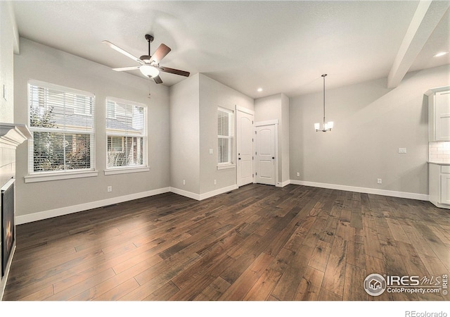 2470 Trio Falls Dr, Loveland, CO 80538 - unfurnished living room featuring ceiling fan, a chandelier, dark wood finished floors, and recessed lighting