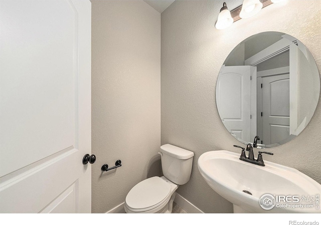 2470 Trio Falls Dr, Loveland, CO 80538 - bathroom with a sink and a textured wall