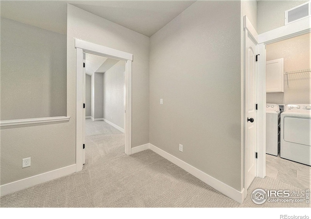 2470 Trio Falls Dr, Loveland, CO 80538 - hallway with light carpet and independent washer and dryer
