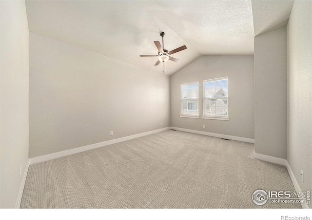 2470 Trio Falls Dr, Loveland, CO 80538 - spare room featuring ceiling fan, vaulted ceiling, and carpet floors
