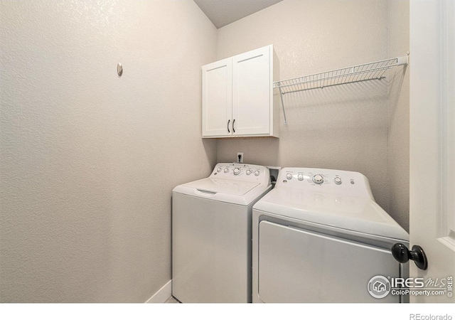 2470 Trio Falls Dr, Loveland, CO 80538 - laundry area featuring cabinet space and independent washer and dryer