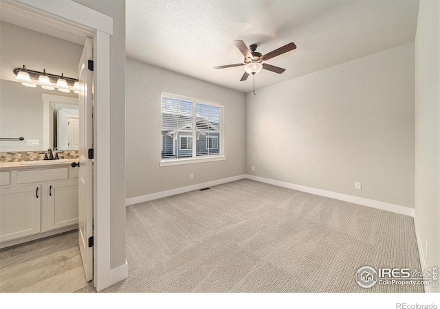 2470 Trio Falls Dr, Loveland, CO 80538 - unfurnished bedroom featuring light colored carpet and connected bathroom