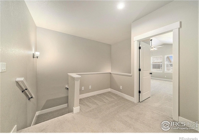 2470 Trio Falls Dr, Loveland, CO 80538 - stairway featuring lofted ceiling, carpet floors, and a ceiling fan