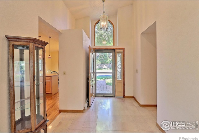 1357 43rd Ave Unit 60, Greeley, CO 80634 - entrance foyer featuring a towering ceiling and a chandelier