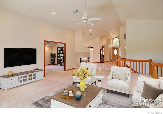 1357 43rd Ave Unit 60, Greeley, CO 80634 - living area featuring light carpet, ceiling fan, high vaulted ceiling, a multi sided fireplace, and recessed lighting